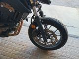 a motorcycle that is parked on the side of the street