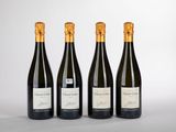 trois bouteilles de vin posées sur une table