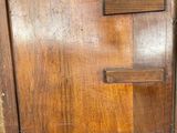 an old wooden cabinet with a door and a drawer