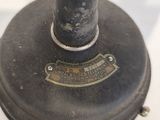 a close up of an antique sewing machine on a table