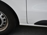 a close up of a white car with a flat tire