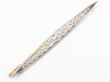 a close up of a silver and gold pen on a white surface