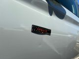 a close up of a sticker on the side of a car