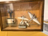a display case with a model of a plane in it