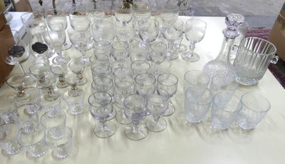 a table with a lot of glasses and a pitcher on it