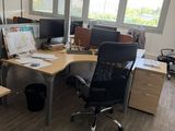 an image of an office with two desks and a chair
