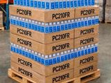 several boxes of water are stacked on a pallet in a warehouse