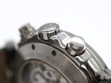 a close up of a watch on a white surface