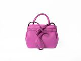 a small pink purse with a bow on the handle