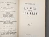 an open book with a black and white image of the title of a poem