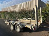 a trailer that is parked in front of a building