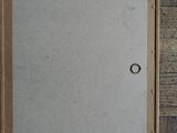 an overhead view of a picture frame on a wood floor