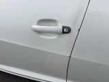 a close up of a door handle on a white car