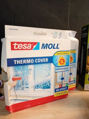 a box of tesa moll thermo cover next to a box of tesa moll