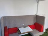 a couch and a table in the corner of a room