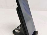 a cell phone that is sitting on a stand