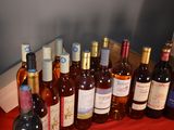 a lot of bottles of wine on the table