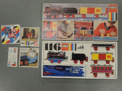 a box with a toy train and other toys on the table