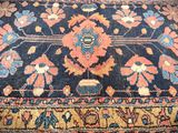 an image of a blue rug with a red and blue design on it