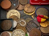a red box filled with coins and a red keychain
