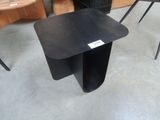 a small black table with a label on it