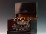 a black cabinet with a bunch of glasses inside of it