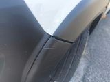 a close up of a car ' s front bumper and fender