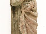 a statue of a man holding a baby in his arms