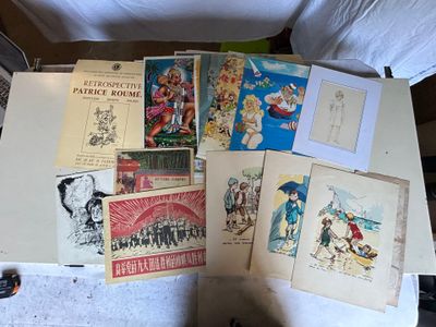 a lot of drawings and pictures on the table
