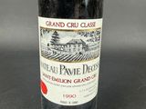 a bottle of wine that is sitting on a table