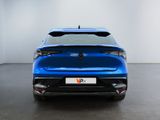the rear end of a blue car in a white room