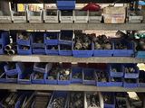 many different types of tools on the shelves in the garage