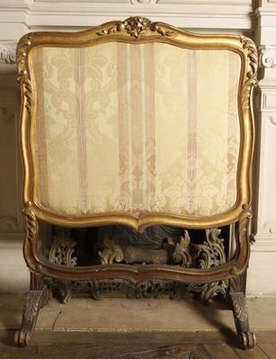 a chair that is sitting in front of a fireplace
