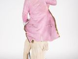 figurine of a man in a pink coat and hat on a pedestal