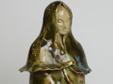 statue of a woman holding a baby in her arms