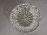 a clear glass bowl with a circular design on it