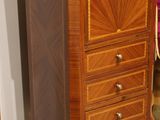 a small wooden cabinet with a sink on top of it