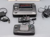 a nintendo game system sitting on a table next to other electronics