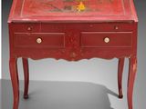 an image of a red table with a drawer on it