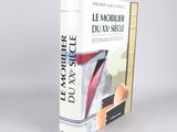 the book is on a white surface with a gray background