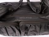 black leather handbag with zippers on a white background