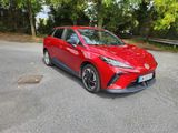 a red toyota c - hr parked on the side of the road