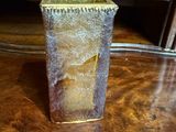 a piece of cake in a glass container on a table