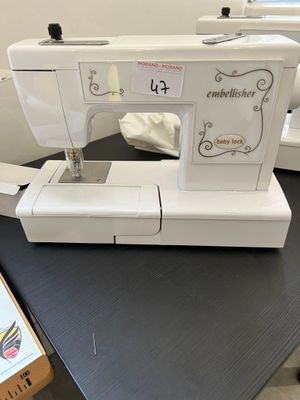 an image of a sewing machine sitting on top of a table
