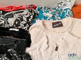 a pile of clothes that is sitting on a table