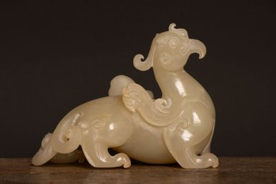 an image of a white sculpture of a horse on a table