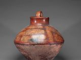 an image of a vase with a lid on a gray background