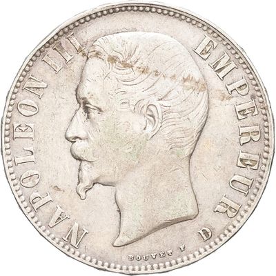 a close up of a coin with a man ' s face on it