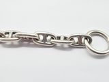 silver plated metal chain with a loop clasp on a white background