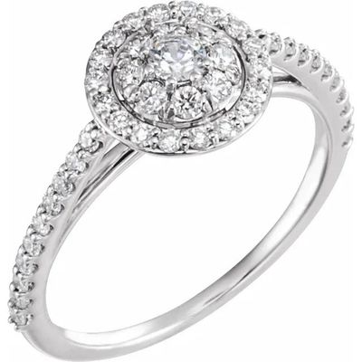 une bague de fiançailles en or blanc sertie d'un diamant rond en son centre
